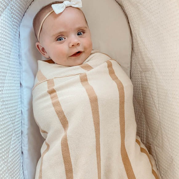 Snuggly Jacks knitted blanket in beige and brown stripes, made of organic cotton and measuring 100 cm x 120 cm