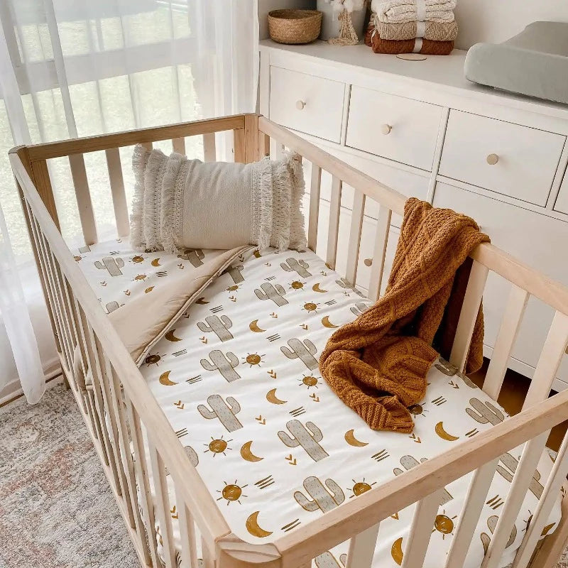 Cot Quilt with Green Cactuses, brown moons with a soft brown backing, makes for the perfect gender neutral nursery.
