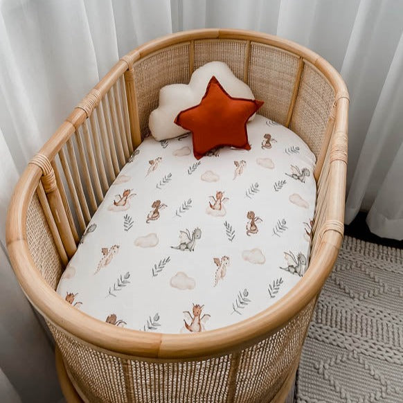 Rattan bassinet made up with the Mystique Bassinet Sheet / Change Mat Cover