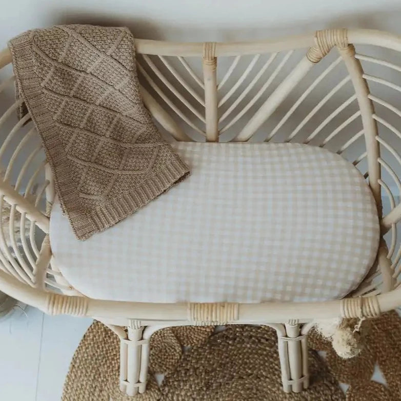 Ratan bassinets make a great addition to every nursery and the sand ginham bassinet sheet / change mat cover matches the boho style perfectly.