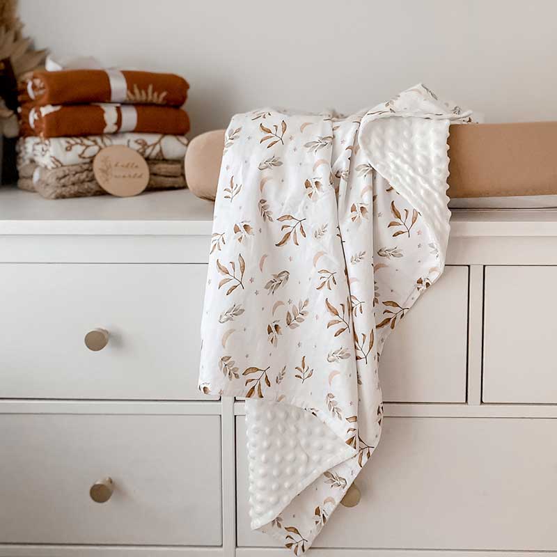 Baby Change Table with a Snuggly Jacks Camel change mat cover and Twilight Minky Blanket Draped over the change mat