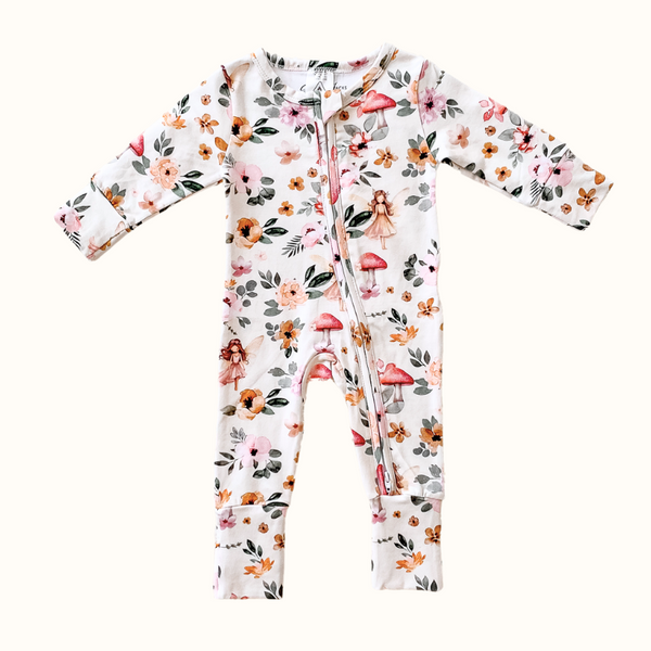 Fairies and floral print organic cotton onesie with two-way zip and vibrant colors, perfect for baby sleepwear and matching nursery decor