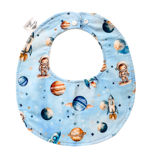 Space Rockets baby bib with vibrant planetary and astronaut prints, crafted from soft organic cotton with an absorbent microfiber backing.