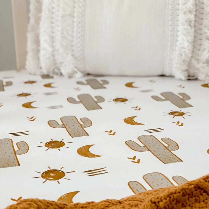 Great simple pattern to fit in any designer nursery, Brown cactus, suns on a white background.