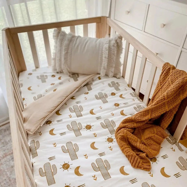 Cotton cot Quilt in the perfect size with the Arizona cactus print on it. Natural Breathable fabrics and wadding.