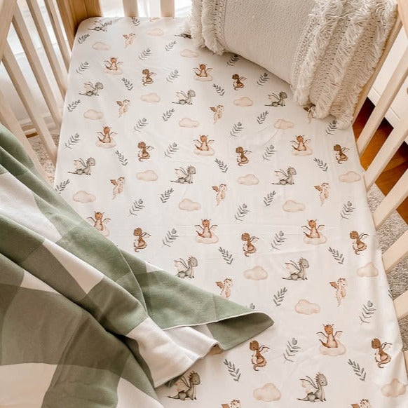 Cute fitted cot sheet from Snuggly Jacks Australia set in a pine cot.