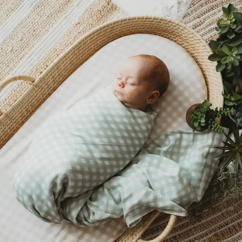 Gingham is a collection we have released soon and comes in Sage and Sand. The bassinet sheets, change mat covers, fitted sheets and top knots are all available in the gingham.