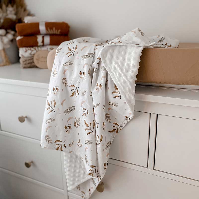 Baby Change Table with a Snuggly Jacks Camel change mat cover and Twilight Minky Blanket Draped over the change mat