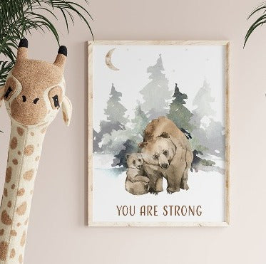 Wooden framed picture of a bear and its cub hanging on a wall in a nursery